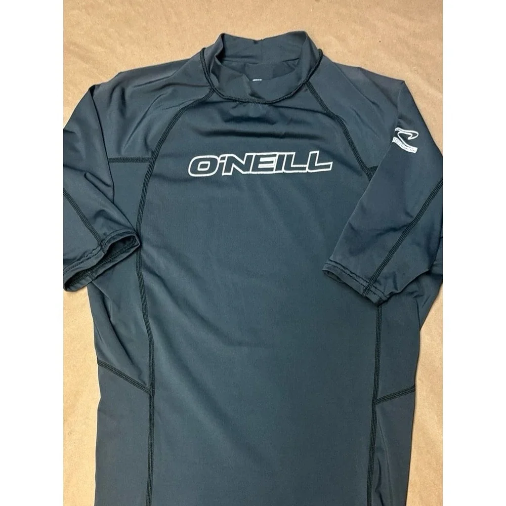 Boys size Medium gray O'Neill rash gaurd with white logo EU.  50+ ultraviolet pr